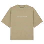 A beige short-sleeve crewneck t-shirt with small white text on the chest reading 'QUERO SIESTA EN PLAYA PARDE', displayed flat against a light off-white background.