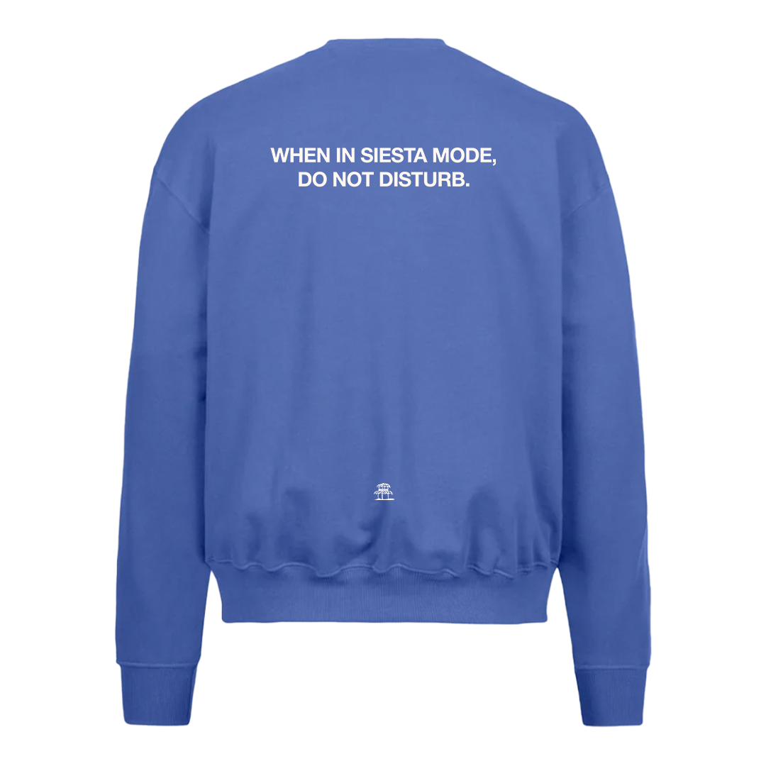 LA SIESTA cobalt blue oversized crew neck sweatshirt with “When in Siesta Mode, Do Not Disturb” text, back view